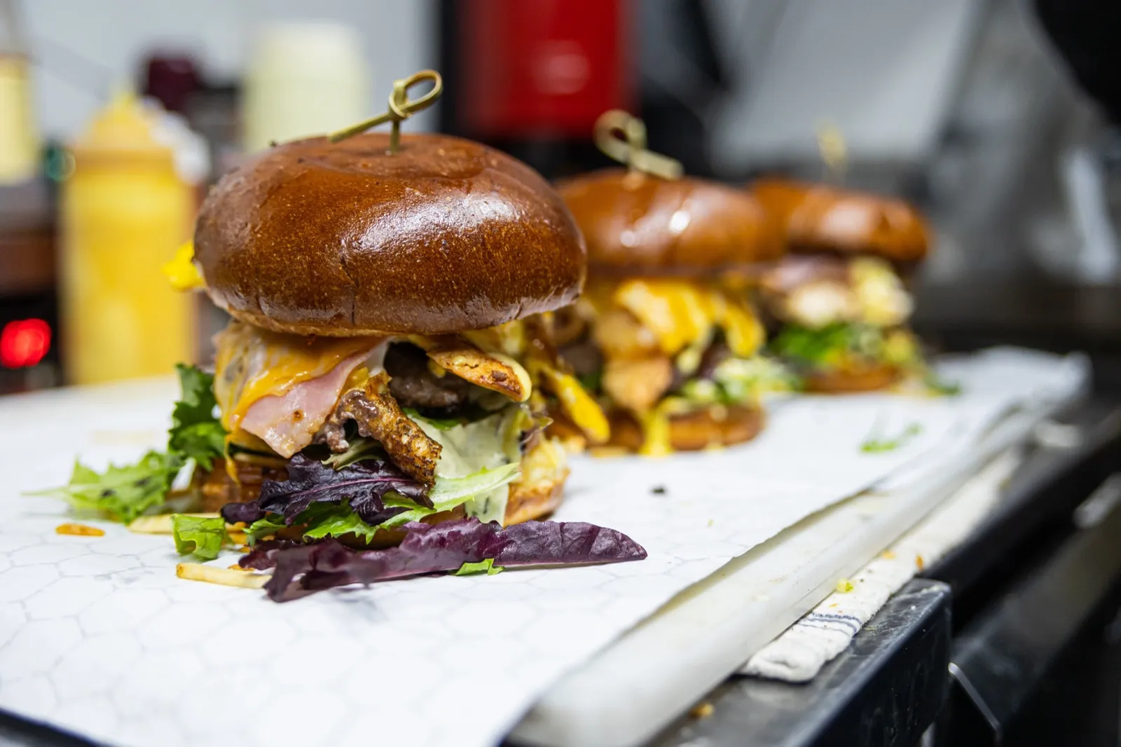 Latinus burgers being prepared on the grill